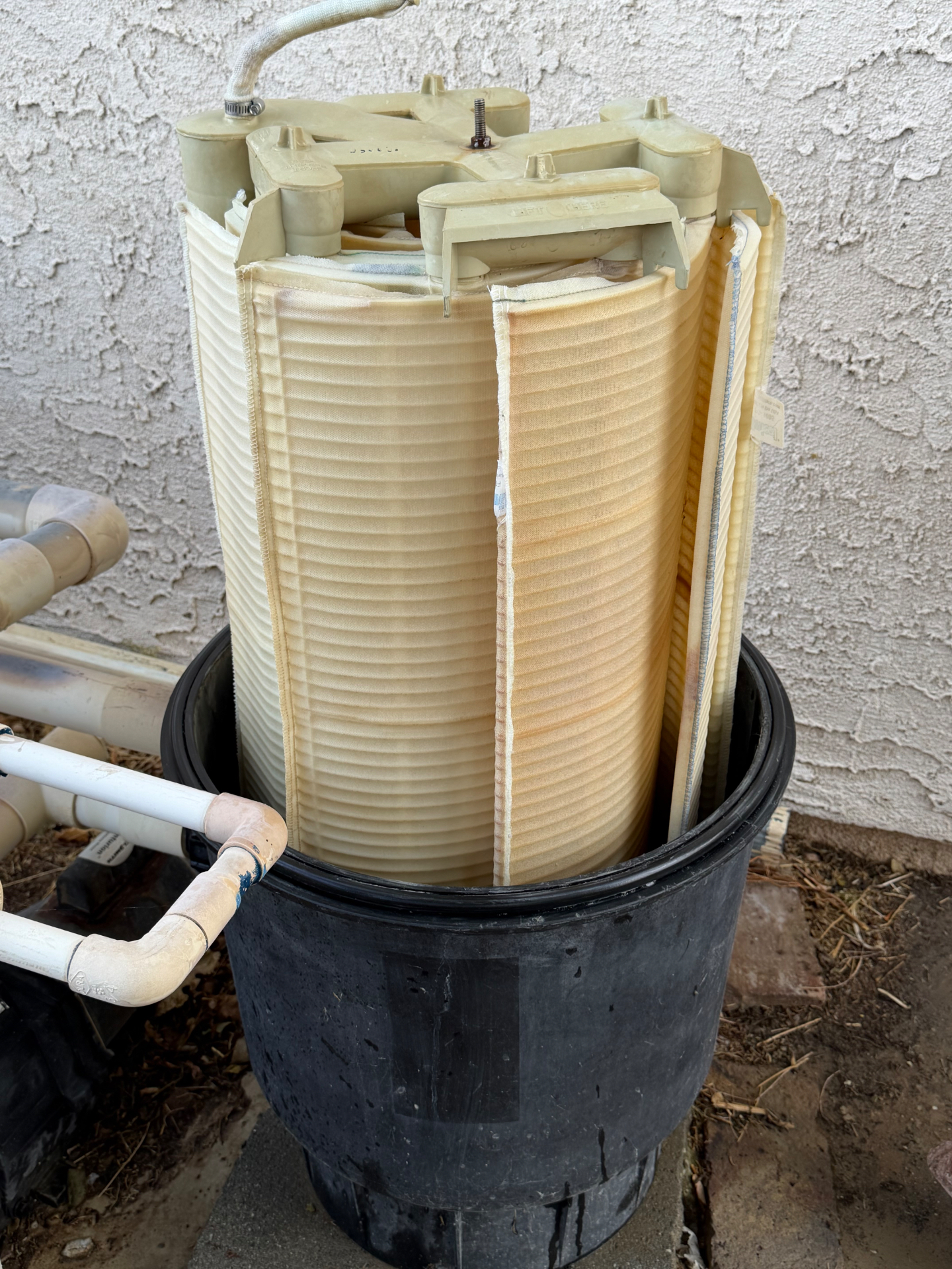 DE filter grid assembly lifted out of the tank for a full tear-down