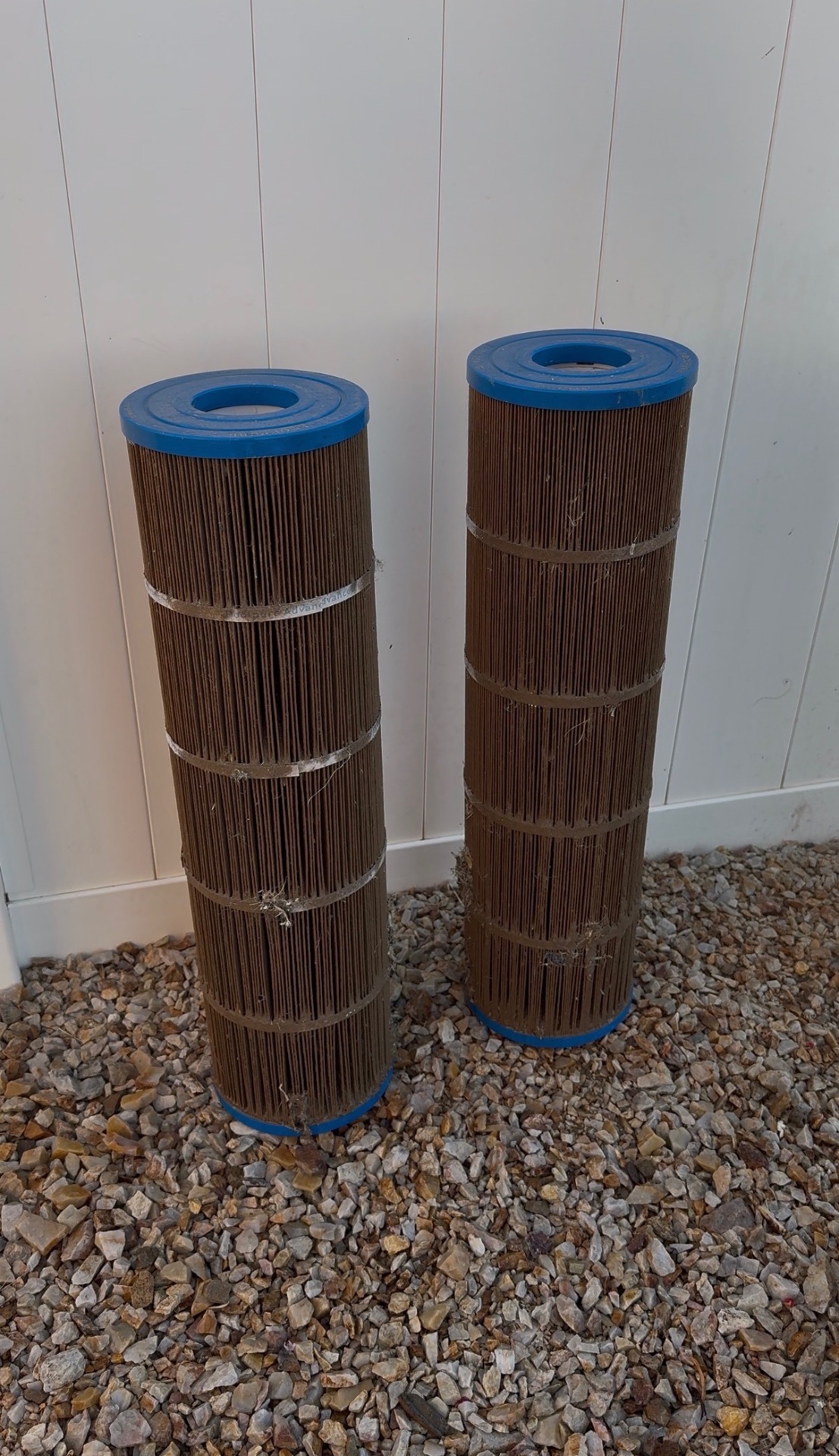 Two dust-packed pool filter cartridges pulled from a High Desert pool